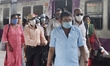 Railway staffs walks past a suburban special train amid Coronavirus emergency in Kolkata,...