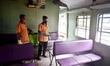 Railway worker sanitises a suburban railway compartment amid Coronavirus emergency in Kolk...