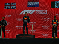 Second placed Lewis Hamilton of Great Britain and Mercedes GP, race winner Max Verstappen of Netherlands and Red Bull Racing and third place...