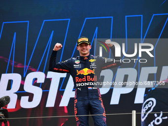 Winner Red Bull's Dutch driver Max Verstappen celebrates on the podium at the end of the French Formula One Grand Prix at the Circuit Paul-R...