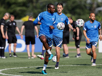 (L to R) Glen Kamara, Thomas Lam and Nikolai Alho of Finland in action during a Finland national team training session ahead of their UEFA E...