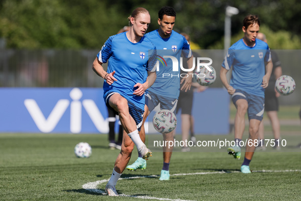 (L to R) Fredrik Jensen, Pyry Soiri and Lassi Lappalainen of Finland in action during a Finland national team training session ahead of thei...