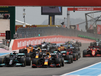 Max Verstappen of Netherlands driving the (33) Red Bull Racing RB16B Honda and Lewis Hamilton of Great Britain driving the (44) Mercedes AMG...