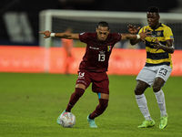 Martinez Torres  player from Venezuela disputes a bid with Caidedo Corozo player from Equador during a match at the Engenhão stadium for the...