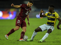 Gonzales Sibuto  player from Venezuela disputes a bid with Caicedo player from Equador during a match at the Engenhão stadium for the Copa A...