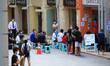 People wait outside a clinic to receive the China made COVID-19 Sinovac vacccine on June 2...