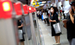 People wearing face masks seen at a major underground  train station in Taipei, as Taiwan...