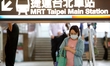 People wearing face masks seen at a major underground  train station in Taipei, as Taiwan...