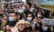 Passengers riding on the first train of the Tuen Ma Line in Hong Kong, Sunday, June 26, 20...