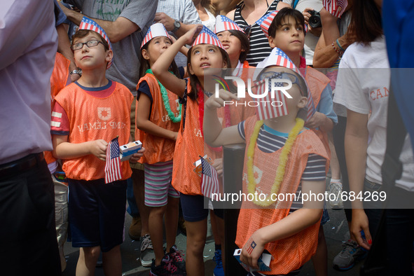 July 10, 2015 - New York, New York - Kids watch the Women's nation soccer team ride along Broadway. The 2015 Women's World Cup Championship...
