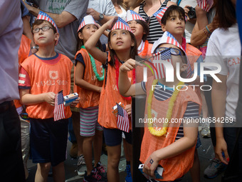 July 10, 2015 - New York, New York - Kids watch the Women's nation soccer team ride along Broadway. The 2015 Women's World Cup Championship...