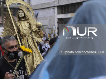 Followers of Santa Muerte in Tepito, Mexico City, Mexico, on July 1, 2021, go to her temple to give thanks for favours fulfilled, also known...