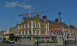 Construction cranes over a construction site located behind The Portobello Pub and Hotel,...