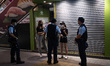 Police officers stopped and searched two girls wearing black clothes and white ribbons. Ac...