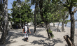Balinese local guard patrols during emergency public activity restriction amid COVID-19 pa...