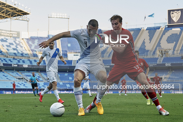 Kyriakos Papadopoulos (NK Lokomotiva Zagreb) of Greece and Kristian Thorstvedt (KRC Genk) of Norway compete for the ball during the internat...