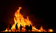 People seen in front of a bonfire during the Eleventh Night marking the start of the union...