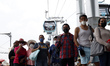 People board line 1 of the Cablebus while Mexico City's Mayor, Claudia Sheinbaum Pardo  in...