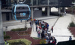 People board line 1 of the Cablebus while Mexico City's Mayor, Claudia Sheinbaum Pardo  in...