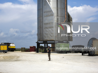 A SpaceX employee stands next to Starship SN15 on July 13th, 2021 in Boca Chica, Texas.  (