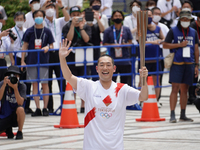Kabuki actor Nakamura Kankuro runs as the last runner for Tokyo during the arrival ceremony for Tokyo Olympic Torch Relay in Shinjuku on Jul...