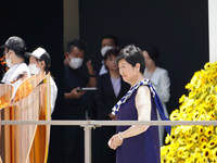 Tokyo governor Koike Yuriko stands on the stage during the arrival ceremony for the Olympic Torch in Shinjuku on July 23, 2021 in Tokyo, Jap...
