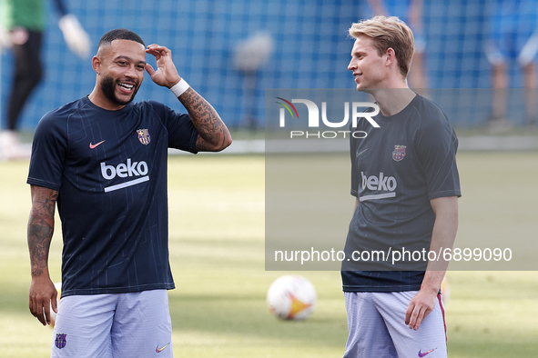 (L-R) Memphis Depay and Frenkie de Jong of Barcelona during the warm-up before the pre-season friendly match between FC Barcelona and Girona...