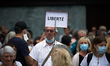 A protester holds a placard 'Librety'. More than 10,000  protesters took to the streets in...