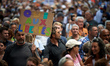 A protester holds a placard reading 'Yes To Liberrties'. More than 10,000  protesters took...