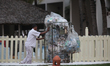 Hotel worker pushes a cart filled with rubbish from tourists hotel rooms at the Occidental...