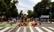 Construction workers watch as thousands of demonstrators march from the White House to the...