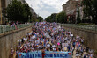 Thousands of demonstrators march from the White House to the Cuban Embassy in Washington,...