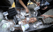 Artist Anne-Katrin Spiess is carried on 5th Avenue in a clear plastic coffin during a prot...