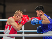 Yuito Moriwaki from Japan and Oleksandr Khyzhniak from Ukraine during pre final boxing knock out rounds at Kokugikan arena at the Tokyo Olym...