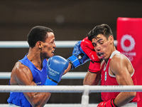 Daniel Francisco Veron from Argentina and Euri Cedeno Martinez from the Dominican Republic during pre final boxing knock out rounds at Kokug...