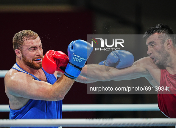 Bakhodir Jalolov from Uzbekistan and Mahammad Abdullayev from Azerbijdan during pre final boxing knock out rounds at Kokugikan arena at the...