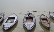 An indian boatman sit on his boat before rains at Dashashwa medha Ghat,on the banks of Riv...