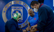 Wrestler Dr Wagner signs a mask for Oscar Perez   during a press conference at La Noria, h...