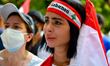People take part in a rally to demand justice for the Beirut Blast on August 4, 2021, in B...