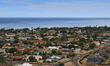 Houses by the Pacific Ocean on the Hawaiian island of Kaua'i, Hawaii, USA. 