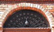 Elaborately carved peacock window above a doorway in the ancient medieval city of Bhaktapu...