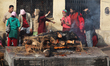 Devotees of Guru Osho attend the cremation of a loved one at Pashupatinath in Kathmandu, N...