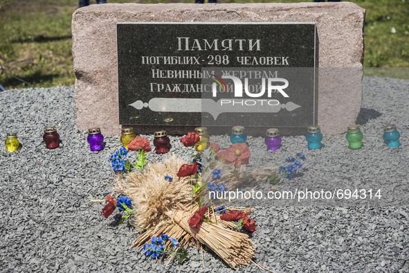 Stone memorial in the place where the malaysian flight MH17 fell in the Hrabove village, Ukraine. Words mean "in memory of the 298 dead peop...
