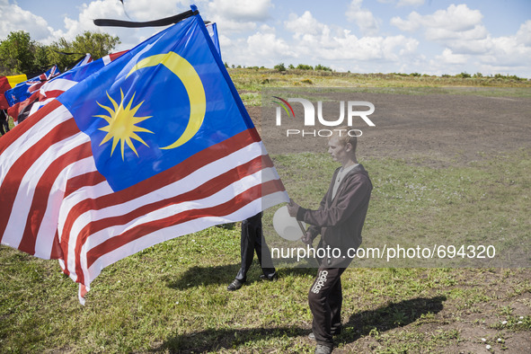 Maysian flag in the place where the malaysian flight MH17 fell in the Hrabove village, Ukraine, during the celebrations of the anniversary o...