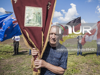 Visitor with a religious icon visit the place where the malaysian flight MH17 fell in the Hrabove village, Ukraine,  during the celebrations...
