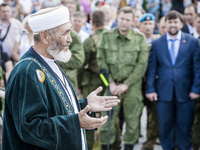 Muslim imam prays in memory of the dead passengers of the tragedy of the malaysian flight MH17 shot down over Hradove village, Ukraine, duri...