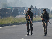 Indian army soldiers walk near the site of encounter in south Kashmir's Kulgam area, India on August 13, 2021. Inspector General of Police (...