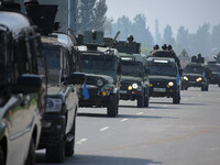 Indian army vehicles move near the site of encounter in south Kashmir's Kulgam area, India on August 13, 2021. Inspector General of Police (...