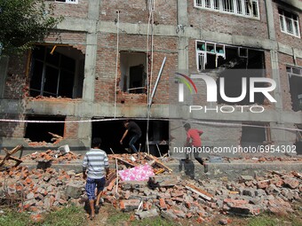 A view of a damaged building where according to police a militant was killed in an encounter in south Kashmir's Kulgam area, India on August...