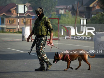 An Indian army soldier walks on the highway near the site of encounter in south Kashmir's Kulgam area, India on August 13, 2021. Inspector G...
